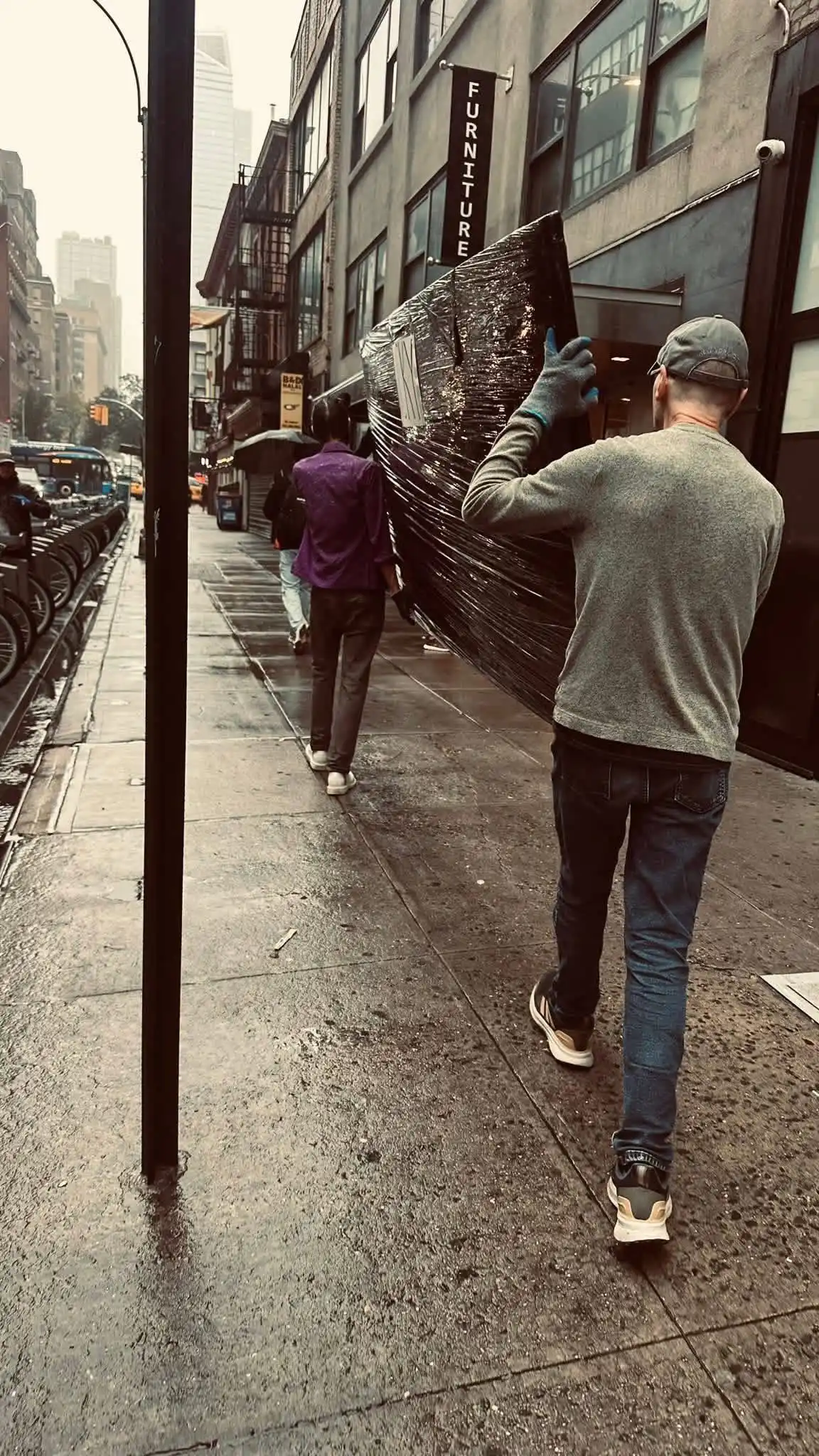 Express Moving NYC crew standing beside a moving truck in New York